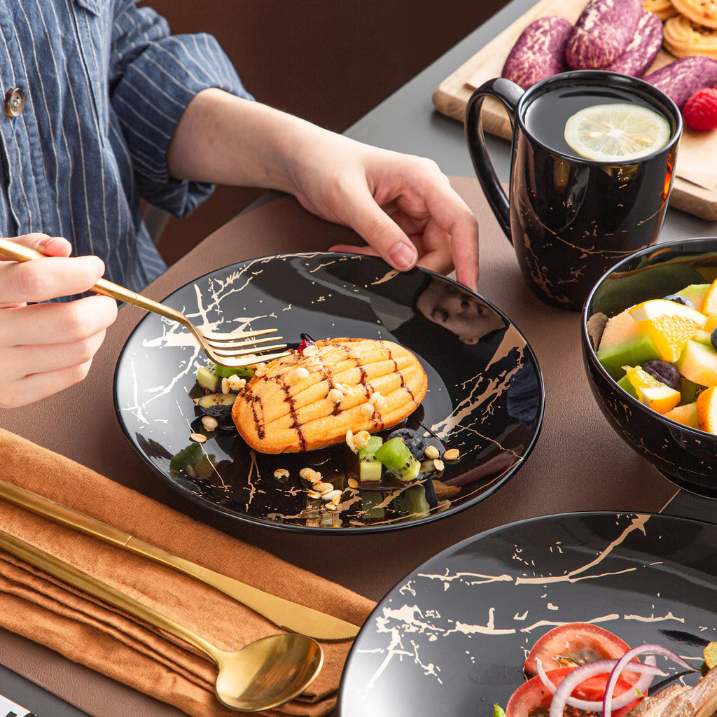Black Porcelain Dinnerware Set with Gold Splash Design