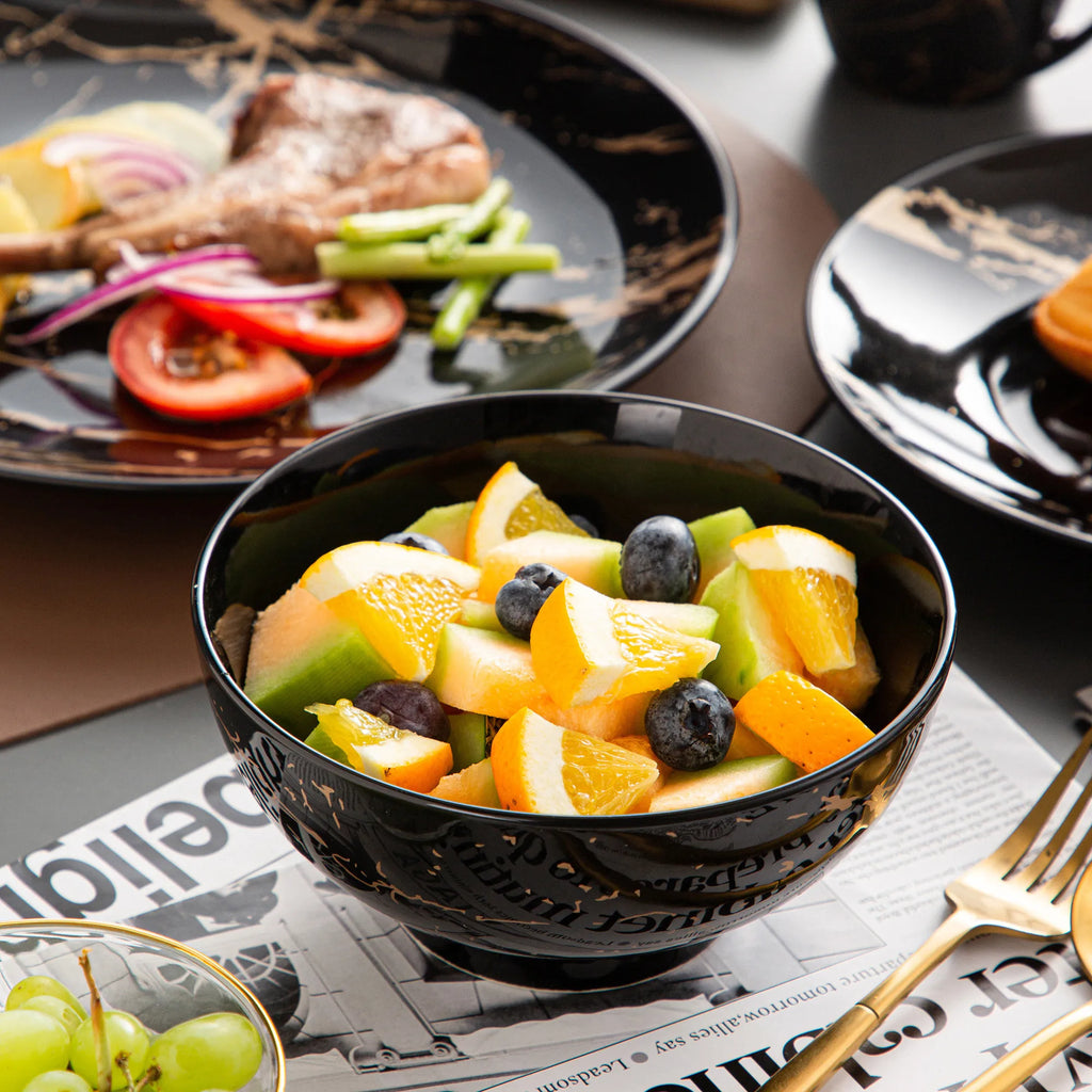 Black Porcelain Dinnerware Set with Gold Splash Design
